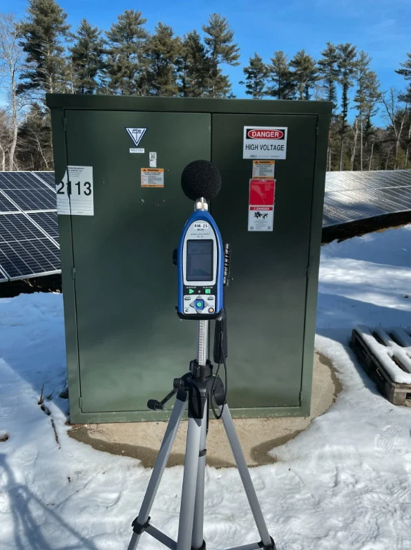 Sound level meter near a transformer. Image: Acentech